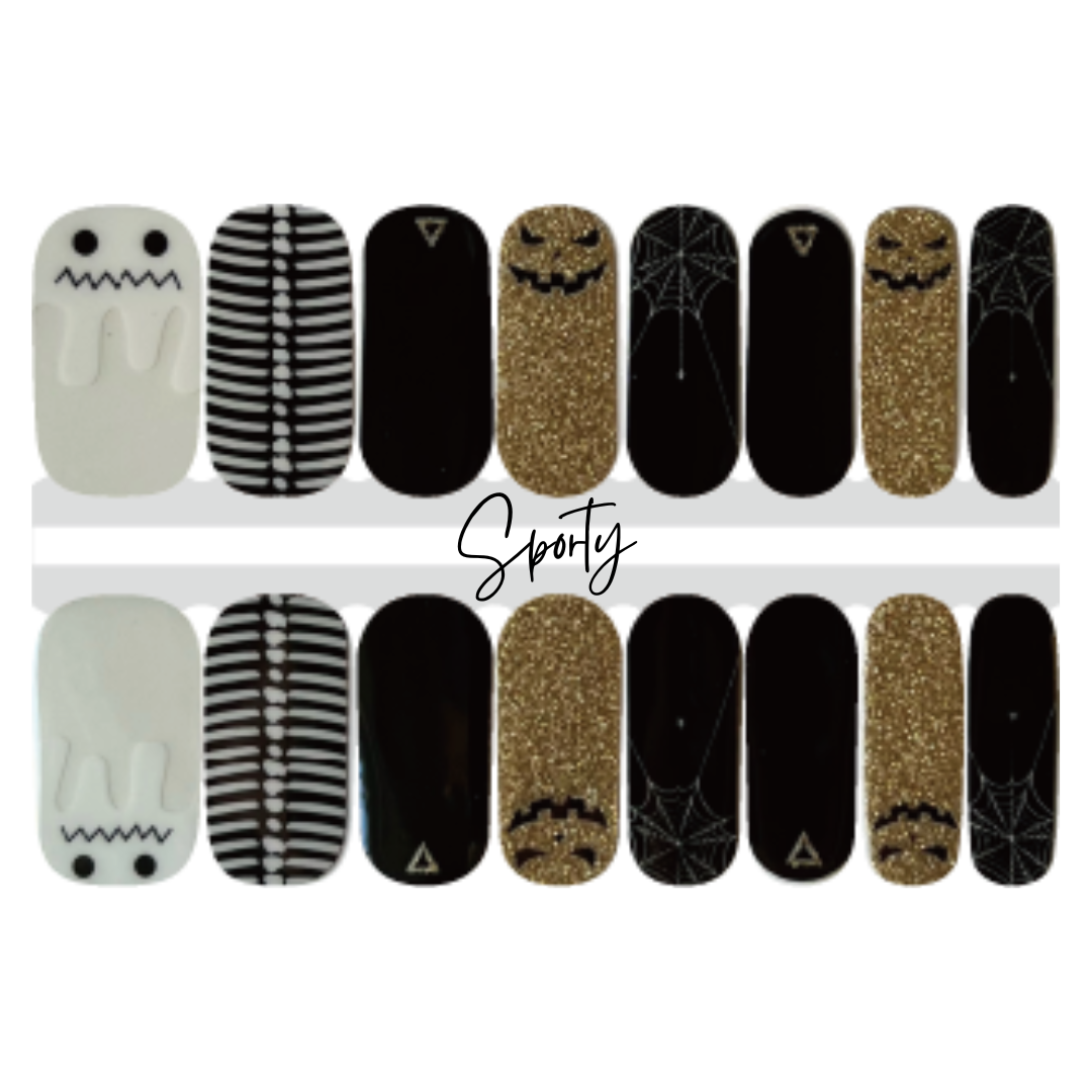 Spooky halloween nail design with ghosts, skeletons, spider webs, and jack-o-lanterns featuring white, black, and gold glitter. 